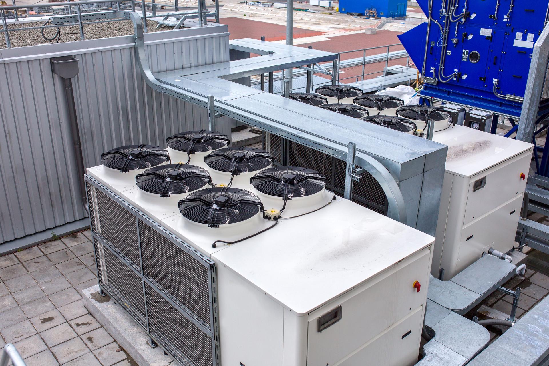 External infrastructure of the microclimate support system at a large industrial site. Air pipelines inlet and exhaust. Fans and air conditioning. Systems of control of pressure, humidity, temperature